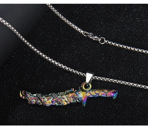 Macro shot of rainbow sword pendant featuring an intricate dragon totem on a steel chain