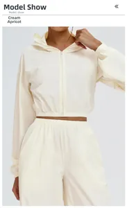 Detail view of Creamy Apricot windproof hooded jacket and pants set with elastic cuffs
