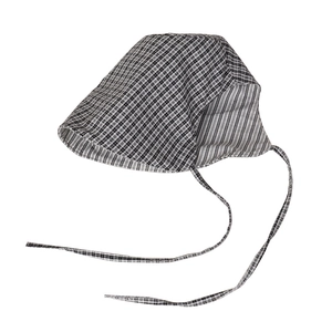 Reversible bucket hat with black and white plaid pattern and adjustable chin straps