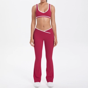 Deep red yoga set with crossover high waist flare pants and contrasting trim vest