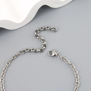 Detailed close-up of the stainless steel chain links and secure lobster clasp closure