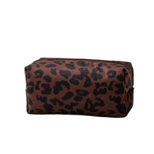 Large leopard print makeup bag with a brown zipper for travel cosmetic storage