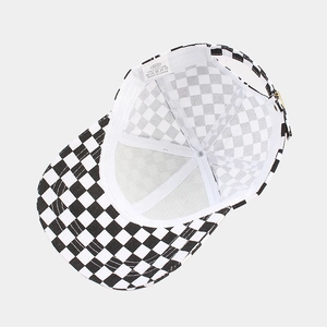 Detailed interior of cotton checkerboard baseball cap with stitching and metal buckle