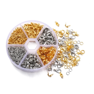 DIY jewelry tool set with gold and silver lobster clasps and open jump rings in a clear box
