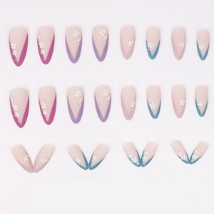 Matte almond press-on nails with colorful French V-tips and white daisy floral patterns