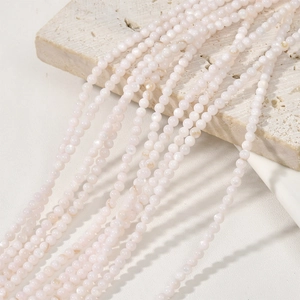 Close-up of 3mm natural white freshwater shell beads strand for DIY jewelry making