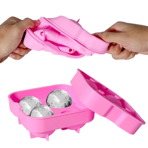 Molde flexible de silicona rosa con 4 cavidades esféricas para desmoldar bolas de hielo