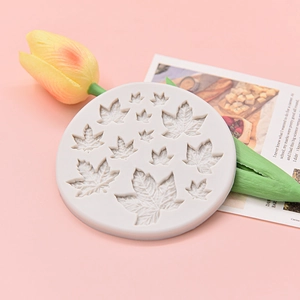 Round silicone fondant mold with detailed maple leaf shapes for cake and chocolate decor