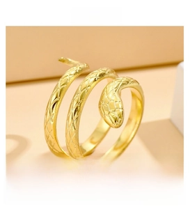 Detailed macro view of gold snake ring with realistic scale textures and spiral wrap design