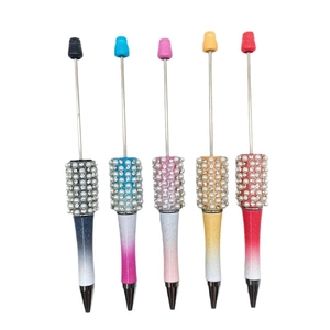 Five assorted colors of DIY beadable pens with gradient glitter finish and pearl accents