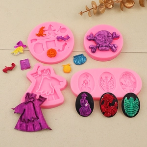 Detailed pink silicone Halloween molds for skulls, pumpkins and skeletal clay fondant