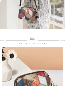 Detail display of patchwork leather crossbody bag with snake skin pattern and metal logo