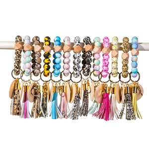 Assorted food-grade silicone bead wristlet keychains with leather tassels and wood beads
