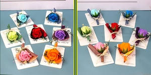 Close-up of assorted soap rose bouquets on cards with Best Wishes text and twine