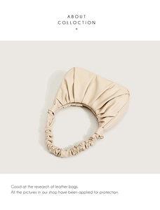 Detail of beige pleated cloud bag showing soft micro-fiber texture and fine craftsmanship