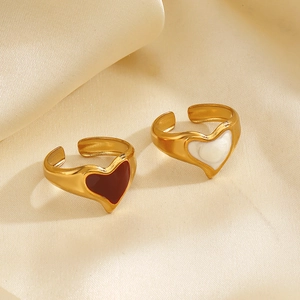 Retro 18K gold plated heart rings with red enamel and pearl insets on silk fabric
