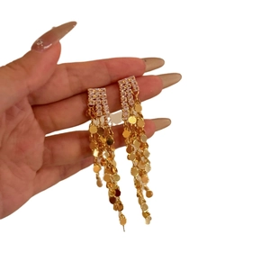 Luxurious gold-plated tassel earrings with sparkling zircon crystals and tiered metal discs