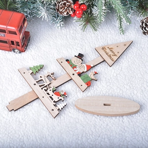 Wooden DIY Christmas tree table ornaments with snowman and reindeer on white fur