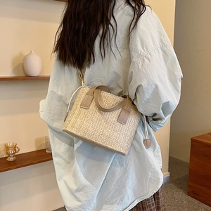 Summer beige straw crossbody bag with khaki leather trim and stylish tassel accents