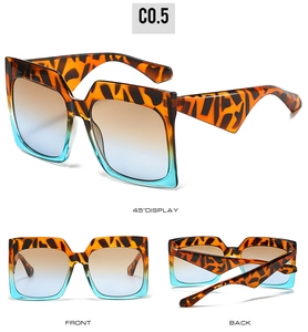 Detail view of square tortoiseshell sunglasses with blue orange gradient lenses