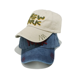 Detail of vintage washed cotton baseball caps with NEW YORK 3D embroidery and stitching