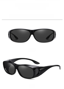 Detail view of large frame high-definition sunglasses in bright black and dark gray lenses