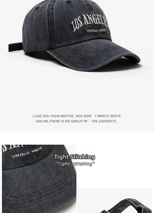 Detailed view of vintage washed denim baseball cap with Los Angeles embroidery and metal buckle