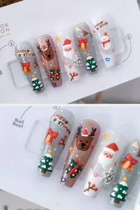 Detailed macro view of 3D embossed Christmas nail art with Santa and reindeer motifs