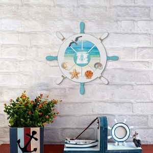 Detail of Mediterranean ship wheel wall decor with sea shells and nautical textures
