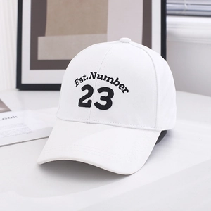 Detailed close-up of white baseball cap with black Est. Number 23 embroidery on the front