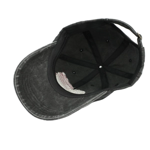 Detail view of the interior seams and adjustable metal buckle on dark grey baseball cap