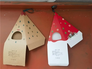 Triangle Christmas gift boxes with green tree pattern and festive red ball ornaments
