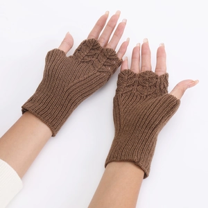 Detailed knit texture of brown fingerless winter gloves for women on white background