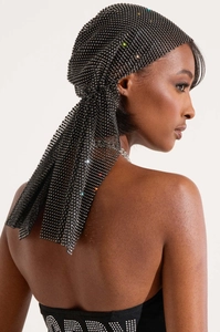 Detailed view of shimmering rhinestones on black mesh headwrap for festivals