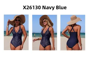 Navy blue one-piece swimsuit with V-neck, metal buckle detail and geometric cut-outs
