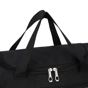 Close-up of black travel bag top featuring silver dual zippers and durable carry straps