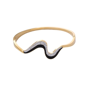 Titanium wave bangle with black and white zircon inlay in a sleek golden finish