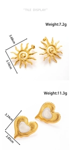 Detail view of gold sun and heart earrings with precise weight and size dimensions