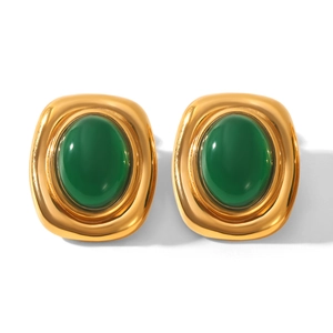 Detail of vintage gold rectangular earrings with oval green gemstone settings