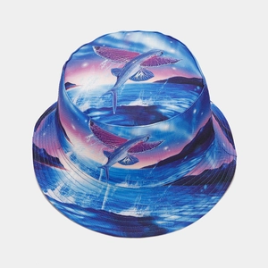 Detail view of reversible sun hat with vibrant dolphin graffiti and sunset ocean pattern