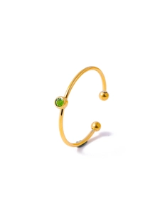 Macro detail of gold open ring featuring a single green zircon stone and spherical ends