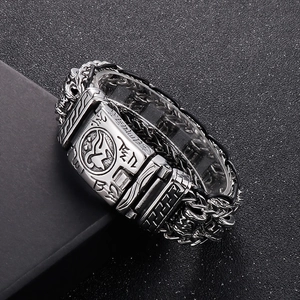 Macro detail of punk leather braided bracelet with titanium steel dragon bone chain