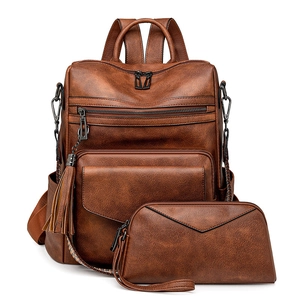 Retro faux leather backpack set for women in brown and black with tassel detail