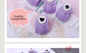 Detail view of craft punches with heart and snowflake patterns for DIY stationery scrapbooking