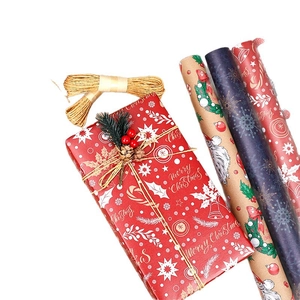 Christmas wrapping paper set with Santa, snowflake patterns and jute twine for holiday gifts
