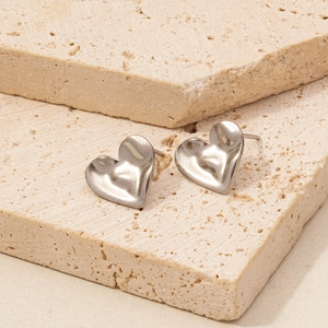 Close-up view of heart-shaped 304 stainless steel stud earrings with a polished finish