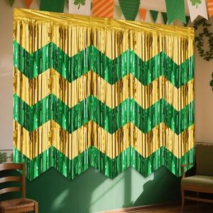 Detail of green and gold chevron wave fringe curtain for festive wall decoration