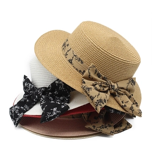 Women's summer straw sun hat with floral bow tie in khaki, white, and pink options