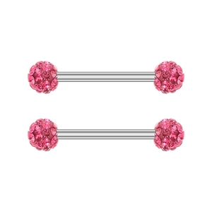 Detailed macro view of pink zircon barbell piercing with silver stainless steel rod
