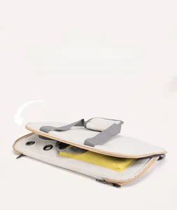 Detailed view of the foldable gray pet carrier showing breathable metal vents and yellow lining